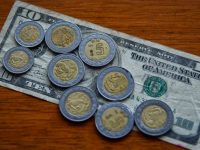 El dólar quiebra el piso de los 19 pesos