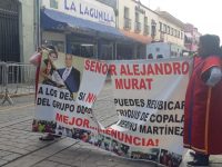 Trifulca entre triquis y comerciantes del 20 de Noviembre